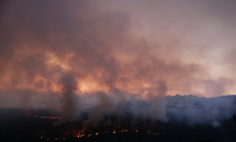 Smoke rises from a wildfire in As Fermosas, in the Ourense province, Galicia, Spain. – Reuters Smoke rises from a wildfire in As Fermosas, in the Ourense province, Galicia, Spain. – Reuters