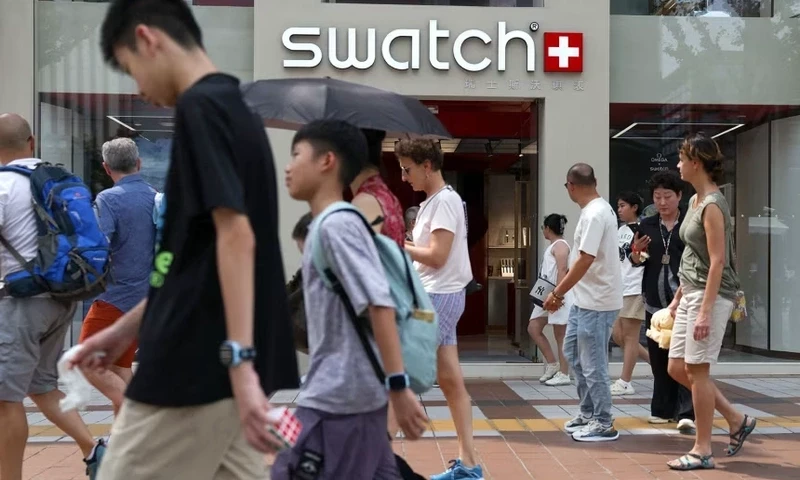 People walk past a store of Swiss watchmaker Swatch, in Beijing, on August 18, 2025. Tingshu Wang/Reuters People walk past a store of Swiss watchmaker Swatch, in Beijing, on August 18, 2025. Tingshu Wang/Reuters