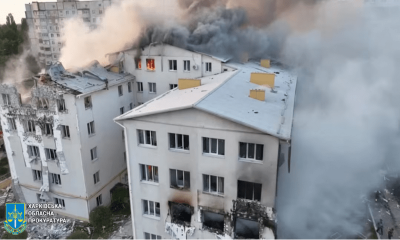 A drone view shows smoke rising from damaged buildings, at the site of an apartment building hit by a Russian drone strike, amid Russia’s attack on Ukraine, at a location given as Kharkiv, Ukraine, in this screengrab taken from a video released on August 18, 2025. Reuters