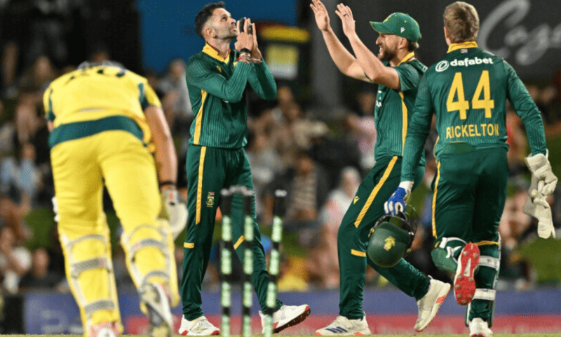 South Africa’s Keshav Maharaj (centre) celebrates with teammates after taking his fifth wicket of Australia’s Aaron Hardie (left) during the first one-day international (ODI) cricket match between Australia and South Africa at Cazaly’s Stadium in Cairns on August 19. — AFP South Africa’s Keshav Maharaj (centre) celebrates with teammates after taking his fifth wicket of Australia’s Aaron Hardie (left) during the first one-day international (ODI) cricket match between Australia and South Africa at Cazaly’s Stadium in Cairns on August 19. — AFP