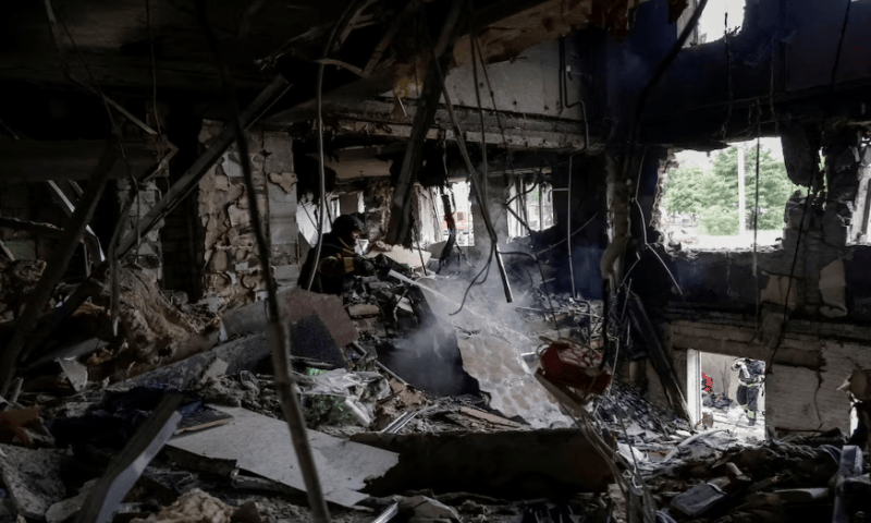 A firefighter works at the site of an apartment building hit by a Russian drone strike. Reuters A firefighter works at the site of an apartment building hit by a Russian drone strike. Reuters