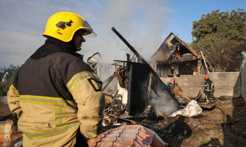 Firefighters work at the site of the Russian missile strike in the village of Sknyliv on the outskirts of Lviv, Ukraine, on Thursday. – Reuters Firefighters work at the site of the Russian missile strike in the village of Sknyliv on the outskirts of Lviv, Ukraine, on Thursday. – Reuters