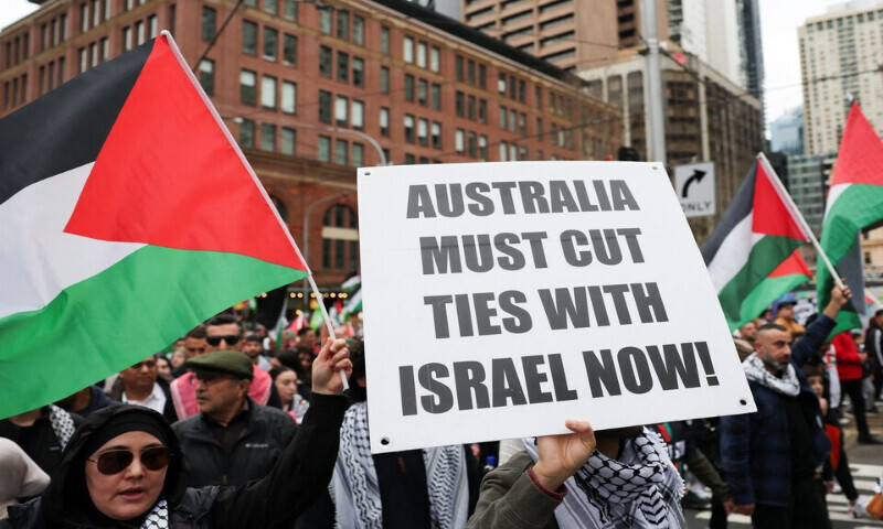 A demonstrator holds a placard as they take part in the ‘Nationwide March for Palestine’ protest in Sydney, Australia, on Sunday. – Reuters A demonstrator holds a placard as they take part in the ‘Nationwide March for Palestine’ protest in Sydney, Australia, on Sunday. – Reuters