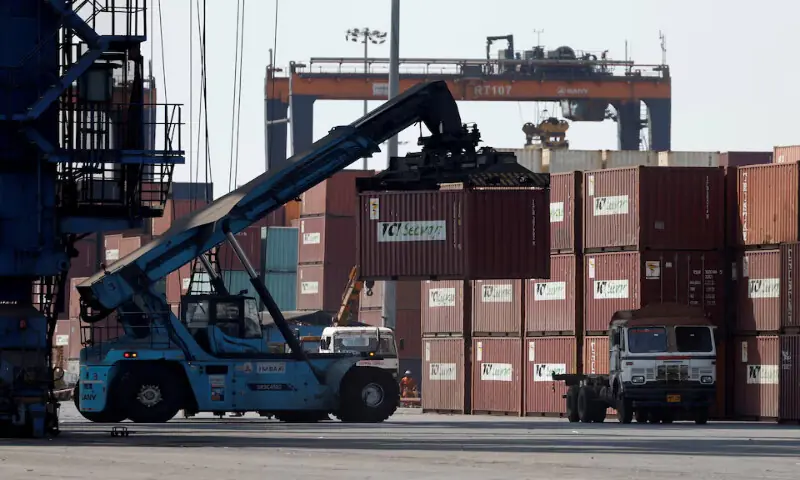 A mobile crane carries a container at Deendayal Port in Kandla, in the western state of Gujarat, India. – Reuters file A mobile crane carries a container at Deendayal Port in Kandla, in the western state of Gujarat, India. – Reuters file