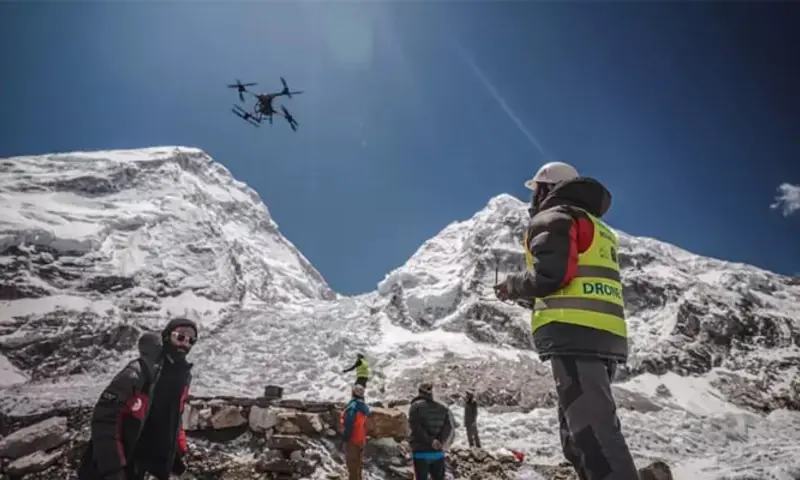A man operates a heavy-lift drone to clear trash dumped at the Everest Base Camp. Photo via  AFP A man operates a heavy-lift drone to clear trash dumped at the Everest Base Camp. Photo via  AFP