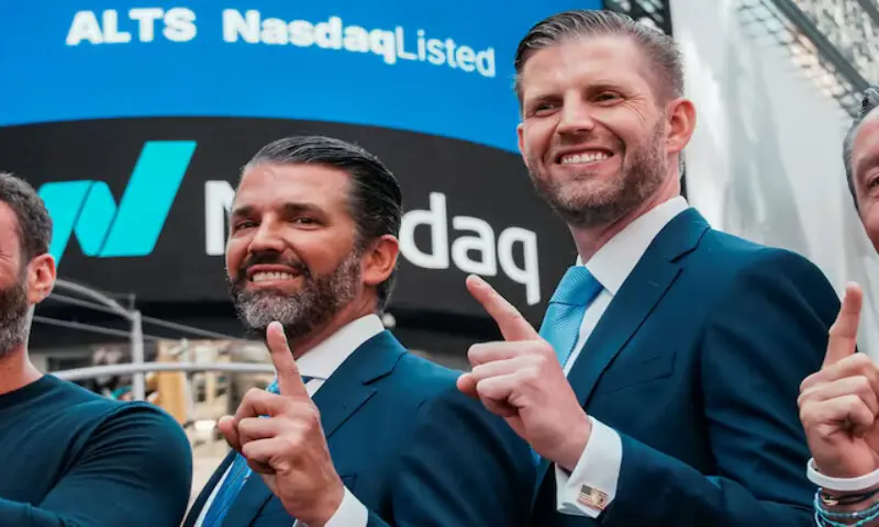 Donald Trump Jr. and Eric Trump gesture outside the Nasdaq building. – Reuters file