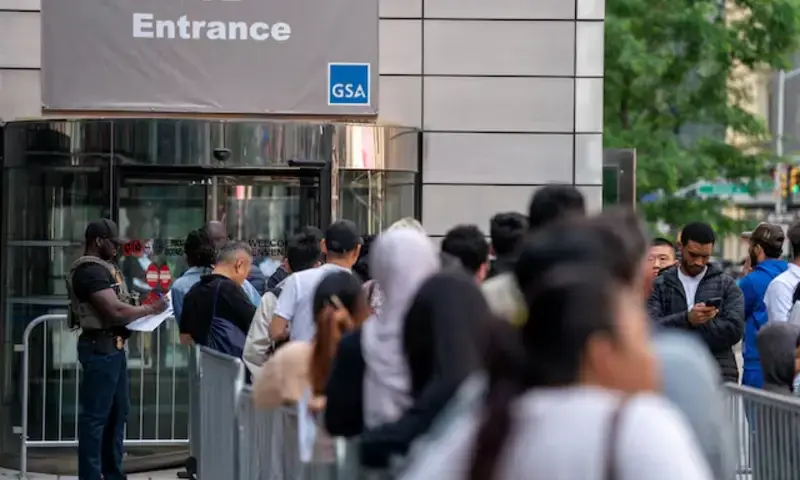 An ICE agent speaks to people lined up to enter the U.S. Immigration Court, in Manhattan, New York City, U.S., June 5, 2025. REUTERS An ICE agent speaks to people lined up to enter the U.S. Immigration Court, in Manhattan, New York City, U.S., June 5, 2025. REUTERS