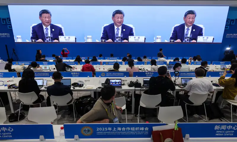 Journalists look at a screen broadcasting Chinese President Xi Jinping delivering a speech during the plenary session of the 2025 Shanghai Cooperation Organisation (SCO) summit in Tianjin, China, on Monday. – Reuters Journalists look at a screen broadcasting Chinese President Xi Jinping delivering a speech during the plenary session of the 2025 Shanghai Cooperation Organisation (SCO) summit in Tianjin, China, on Monday. – Reuters