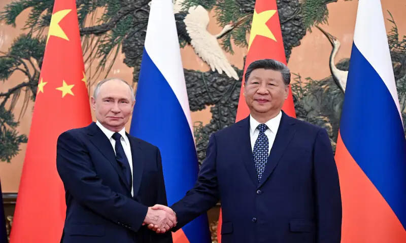 Russian President Vladimir Putin and Chinese President Xi Jinping pose for photos before their meeting in Beijing, China, on Tuesday. – Reuters Russian President Vladimir Putin and Chinese President Xi Jinping pose for photos before their meeting in Beijing, China, on Tuesday. – Reuters