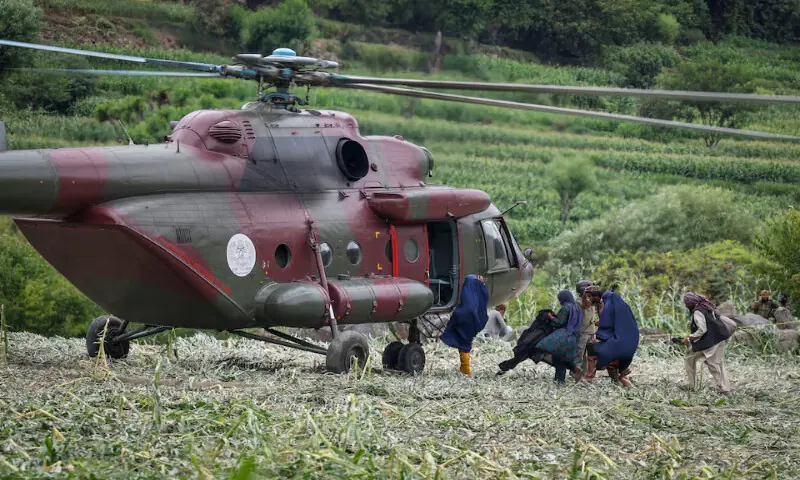 A Taliban military helicopter evacuates the victims of the earthquake in Mazar Dara, Kunar province, Afghanistan. – Reuters