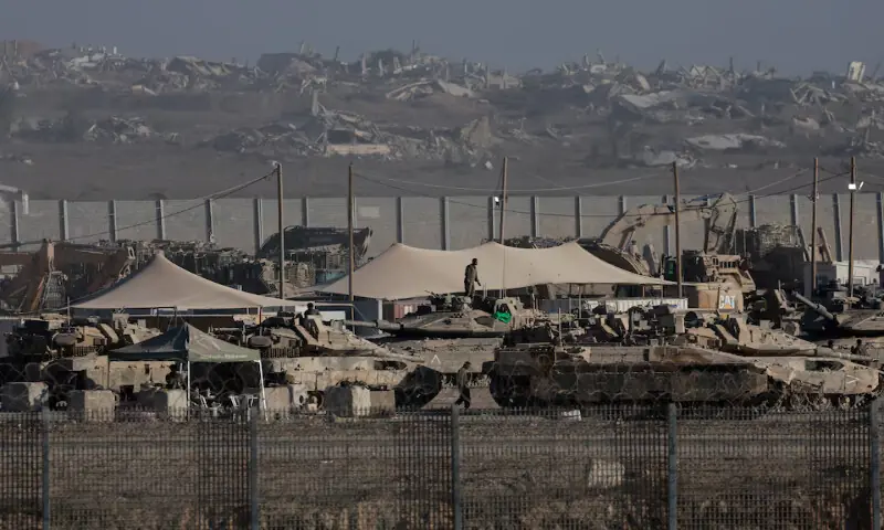 Israeli military personnel gather near army vehicles and heavy machinery, along the border with Gaza. – Reuters Israeli military personnel gather near army vehicles and heavy machinery, along the border with Gaza. – Reuters