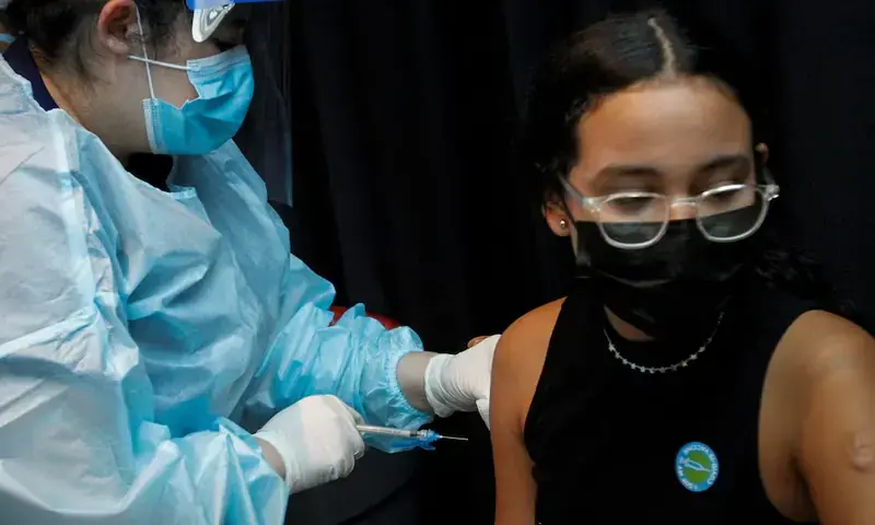 A girl is inoculated against the coronavirus disease (COVID-19) during a vaccination event hosted by Miami-Dade County and Miami Heat, at FTX Arena in Miami, Florida, U.S., August 5, 2021. REUTERS A girl is inoculated against the coronavirus disease (COVID-19) during a vaccination event hosted by Miami-Dade County and Miami Heat, at FTX Arena in Miami, Florida, U.S., August 5, 2021. REUTERS
