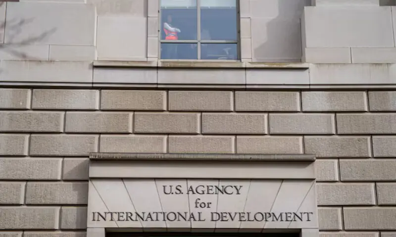 A worker looks out of the window of the US Agency for International Development building in Washington. – Reuters file A worker looks out of the window of the US Agency for International Development building in Washington. – Reuters file