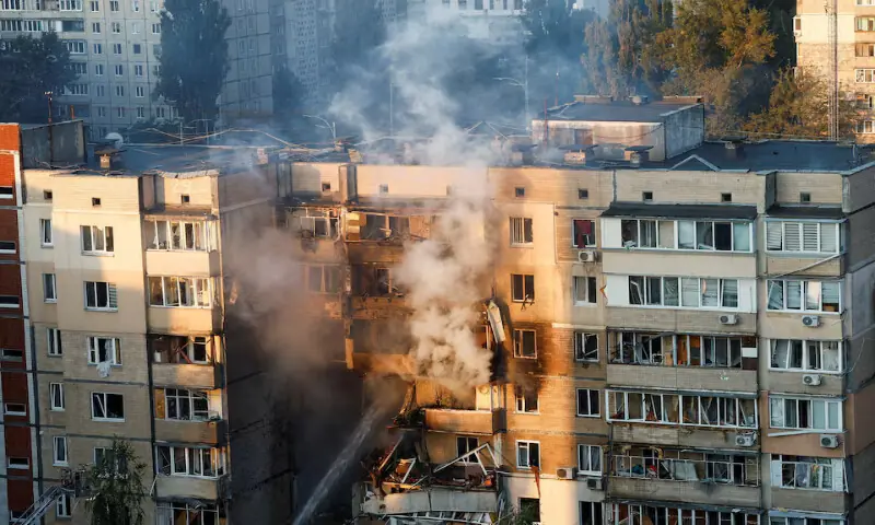 Emergency workers extinguish a fire in an apartment building that was damaged during a Russian drone strike in Kyiv, Ukraine, on Sunday. – Reuters