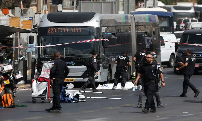 Israeli police officers work at the scene of a shooting attack on the outskirts of Jerusalem on Monday. – Reuters Israeli police officers work at the scene of a shooting attack on the outskirts of Jerusalem on Monday. – Reuters
