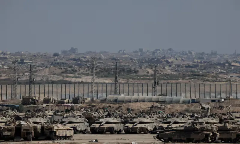 Military vehicles stand on the Israeli side of the border with Gaza. – Reuters Military vehicles stand on the Israeli side of the border with Gaza. – Reuters