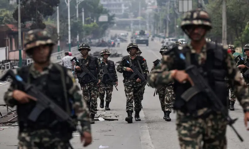 Nepali army soldiers patrol at the road near the Singha Durbar office complex that houses the Prime Minister’s Office and other ministries, following protests in Kathmandu, Nepal, on Wednesday. – Reuters Nepali army soldiers patrol at the road near the Singha Durbar office complex that houses the Prime Minister’s Office and other ministries, following protests in Kathmandu, Nepal, on Wednesday. – Reuters