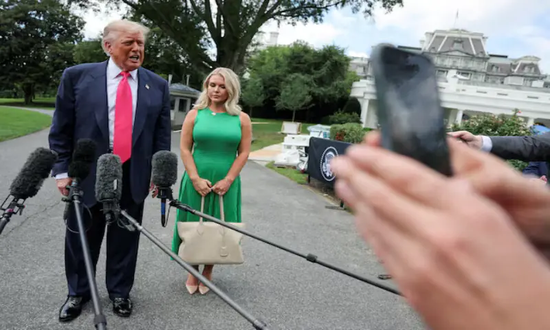 US President Donald Trump speaks with reporters, while White House Press Secretary Karoline Leavitt stands next to him, at the White House in Washington, DC. – Reuters file US President Donald Trump speaks with reporters, while White House Press Secretary Karoline Leavitt stands next to him, at the White House in Washington, DC. – Reuters file