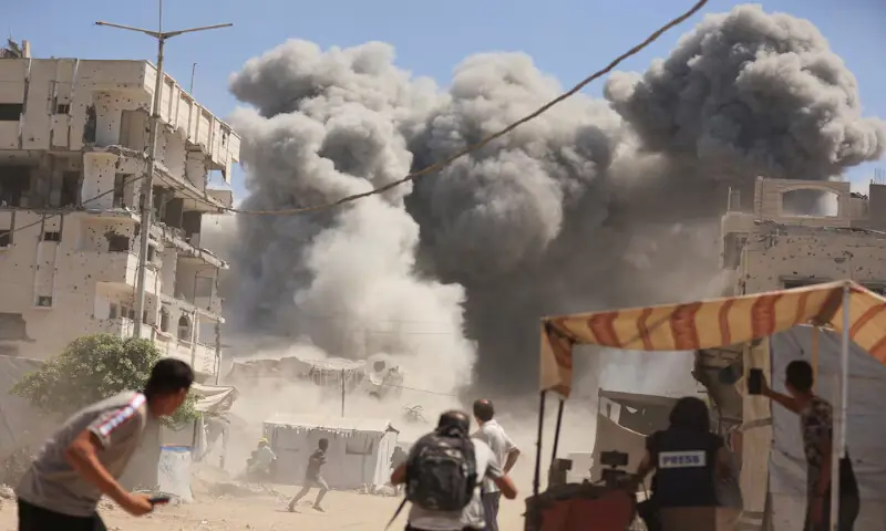 Smoke rises from a residential building after it was hit by an Israeli air strike in Gaza City on Sunday. – Reuters Smoke rises from a residential building after it was hit by an Israeli air strike in Gaza City on Sunday. – Reuters