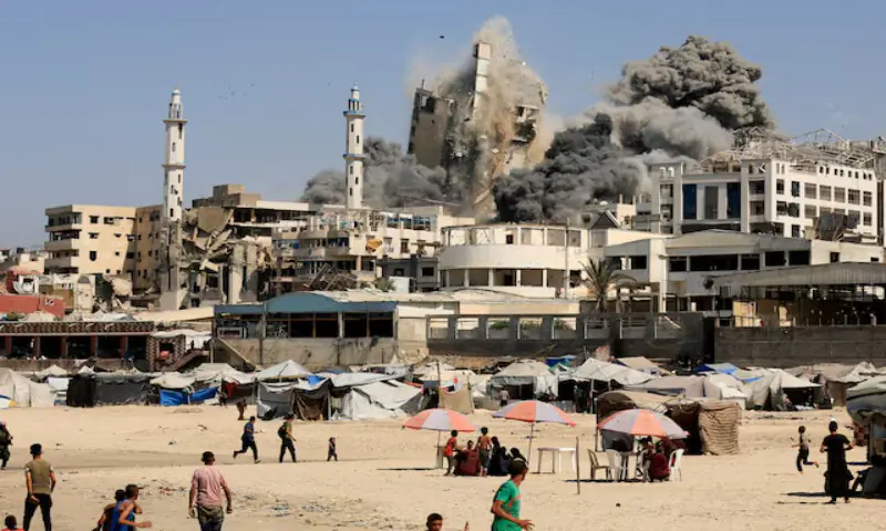 Smoke rises from the Al Ghefari tower after it was hit by Israeli air strikes. – Reuters Smoke rises from the Al Ghefari tower after it was hit by Israeli air strikes. – Reuters