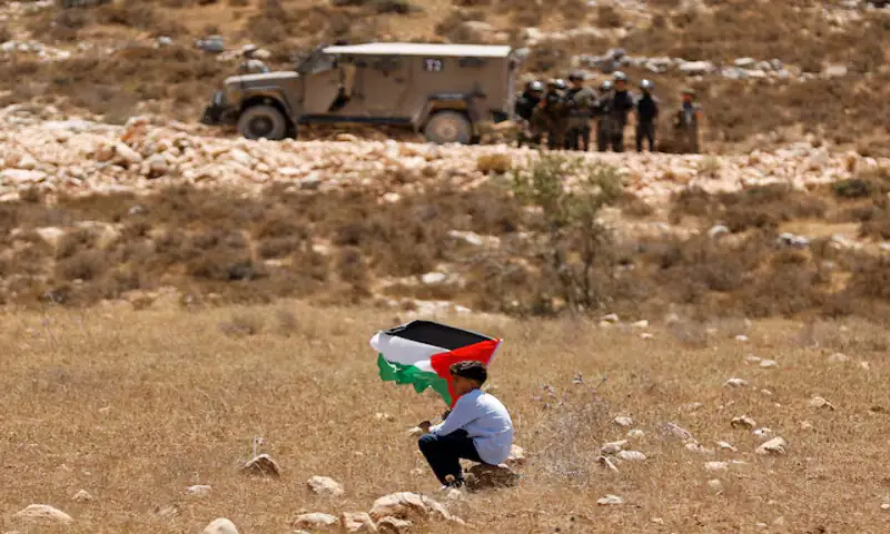 A boy holds a Palestinian flag during a demonstration against Israel’s confiscation of their land in Raba, near Jenin. – Reuters A boy holds a Palestinian flag during a demonstration against Israel’s confiscation of their land in Raba, near Jenin. – Reuters