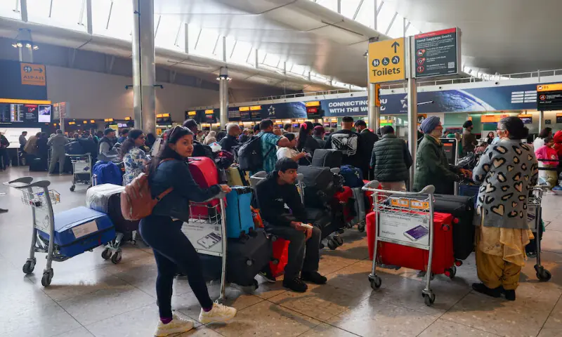 Travellers wait near check-in desks at Heathrow Airport Terminal 2 amid flight delays and cancellations in Greater London, Britain, on Saturday. – Reuters Travellers wait near check-in desks at Heathrow Airport Terminal 2 amid flight delays and cancellations in Greater London, Britain, on Saturday. – Reuters