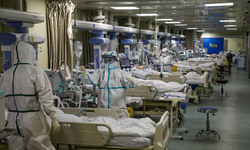 Medical workers in protective suits attend to Covid-19 patients at the intensive care unit of a designated hospital during the coronavirus disease outbreak in Wuhan, Hubei province, China. – Reuters file Medical workers in protective suits attend to Covid-19 patients at the intensive care unit of a designated hospital during the coronavirus disease outbreak in Wuhan, Hubei province, China. – Reuters file