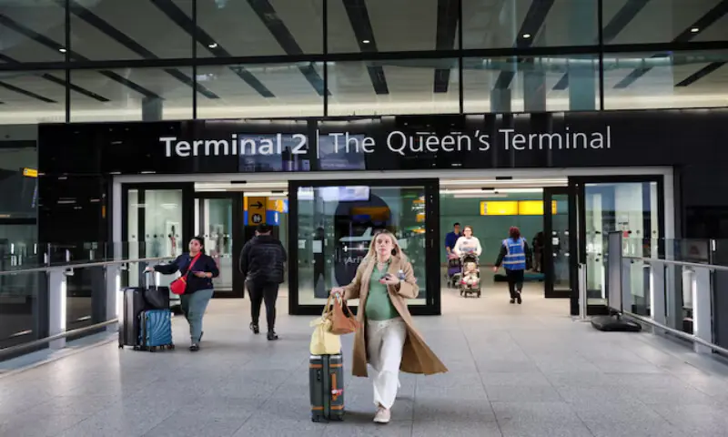People walk at Terminal 2 of the Heathrow International Airport, near London, Britain. – Reuters file People walk at Terminal 2 of the Heathrow International Airport, near London, Britain. – Reuters file