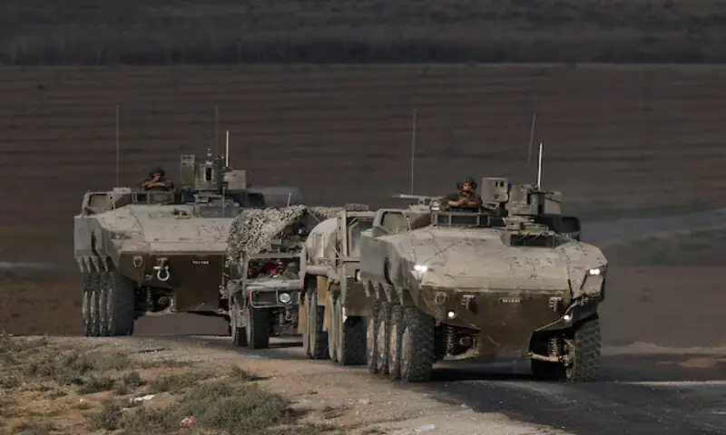 An Israeli military convoy manoeuvres on the Israeli side of the Israel-Gaza border. – Reuters An Israeli military convoy manoeuvres on the Israeli side of the Israel-Gaza border. – Reuters