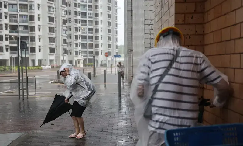 People brave strong winds as Super Typhoon Ragasa approaches, in Hong Kong, China, September 24, 2025. REUTERS People brave strong winds as Super Typhoon Ragasa approaches, in Hong Kong, China, September 24, 2025. REUTERS