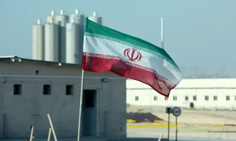 Iranian flag flutters in front of a nuclear site in Iran. Photo via AFP Iranian flag flutters in front of a nuclear site in Iran. Photo via AFP