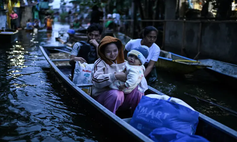 People ride on a boat to cross a flooded street following rains, intensified by Severe Tropical Storm Bualoi, in Dela Paz, Binan, Laguna province, Philippines. – Reuters People ride on a boat to cross a flooded street following rains, intensified by Severe Tropical Storm Bualoi, in Dela Paz, Binan, Laguna province, Philippines. – Reuters