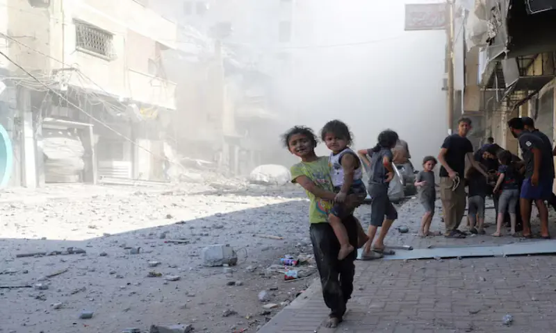 Palestinian children react at the site of Israeli strikes on a house in Gaza City. – Reuters Palestinian children react at the site of Israeli strikes on a house in Gaza City. – Reuters