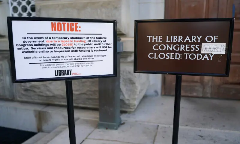 Signs stand outside the Library of Congress on the first day of a partial government shutdown in Washington, DC. – Reuters Signs stand outside the Library of Congress on the first day of a partial government shutdown in Washington, DC. – Reuters