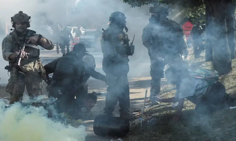Tear gas rises during a standoff with US Immigration and Customs Enforcement and federal officers in the Little Village neighbourhood of Chicago, Illinois. – Reuters Tear gas rises during a standoff with US Immigration and Customs Enforcement and federal officers in the Little Village neighbourhood of Chicago, Illinois. – Reuters