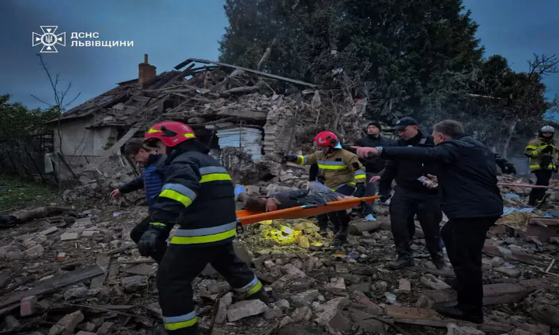 Rescuers carry an injured person on a stretcher over debris of a residential house heavily damaged during Russian drone and missile strikes in the Lviv region, Ukraine, on Sunday Rescuers carry an injured person on a stretcher over debris of a residential house heavily damaged during Russian drone and missile strikes in the Lviv region, Ukraine, on Sunday