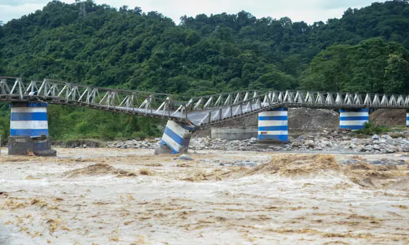 The collapsed Dudhia Iron Bridge over the Balason River after torrential rains in Darjeeling, India. – Reuters The collapsed Dudhia Iron Bridge over the Balason River after torrential rains in Darjeeling, India. – Reuters
