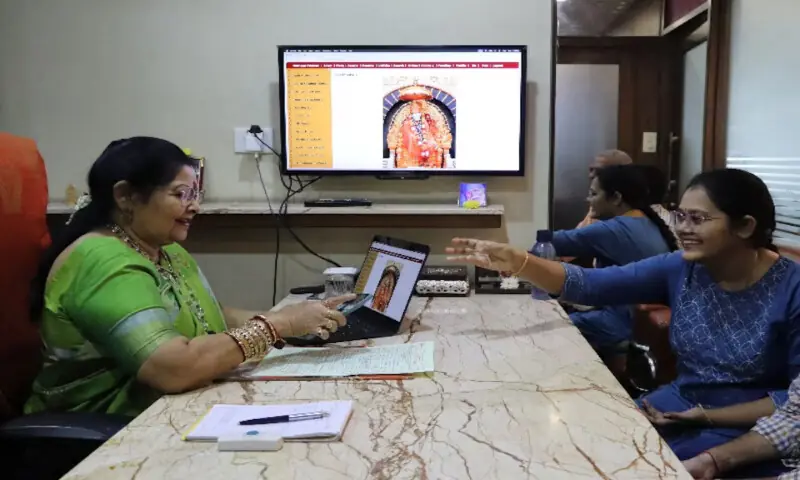 Laksmi Chandana shows a picture of her brother, who lives in Australia, to Vanaja Rao, owner of a matchmaking agency, to look for a suitable prospect in Hyderabad, India. – Reuters Laksmi Chandana shows a picture of her brother, who lives in Australia, to Vanaja Rao, owner of a matchmaking agency, to look for a suitable prospect in Hyderabad, India. – Reuters