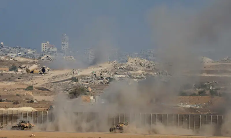 An Israeli military vehicles manoeuvre on the Israeli side of the Israel-Gaza border, as seen from southern Israel, October 7, 2025. REUTERS An Israeli military vehicles manoeuvre on the Israeli side of the Israel-Gaza border, as seen from southern Israel, October 7, 2025. REUTERS