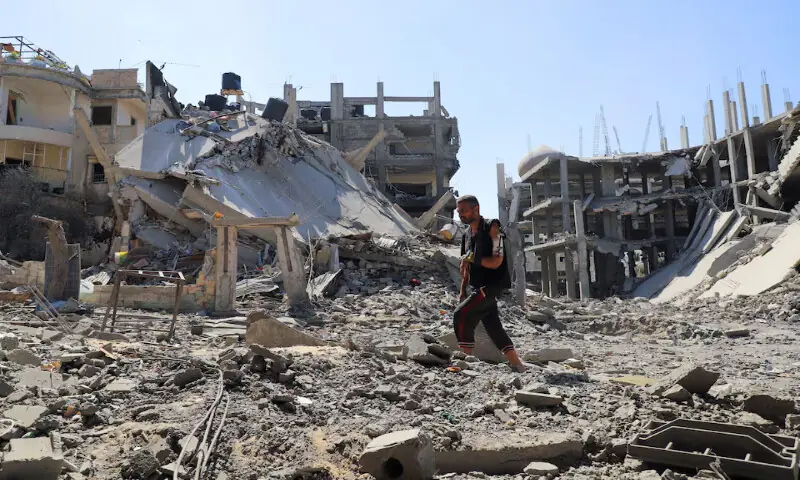 Palestinian man Jehad Al Shagnobi, who was injured in an earlier Israeli strike on his house, walks with an external fixator on his arm to inspect the damage at his home in Sabra neighbourhood following an Israeli operation, at the Sabra neighbourhood in Gaza City. – Reuters Palestinian man Jehad Al Shagnobi, who was injured in an earlier Israeli strike on his house, walks with an external fixator on his arm to inspect the damage at his home in Sabra neighbourhood following an Israeli operation, at the Sabra neighbourhood in Gaza City. – Reuters