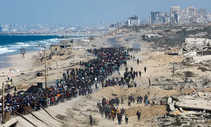 Palestinians, who were displaced to the southern part of Gaza at Israel’s order during the war, walk along a road as they attempt to return to the north after a ceasefire between Israel and Hamas in Gaza went into effect, in the central Gaza Strip, on October 10, 2025. Reuters Palestinians, who were displaced to the southern part of Gaza at Israel’s order during the war, walk along a road as they attempt to return to the north after a ceasefire between Israel and Hamas in Gaza went into effect, in the central Gaza Strip, on October 10, 2025. Reuters