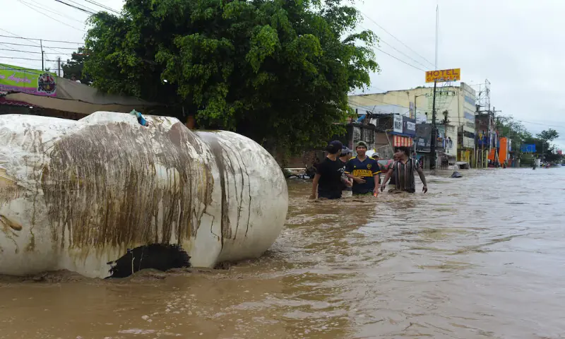 People wade through a flooded street after torrential rains that caused an overflow of rivers in Poza Rica, Veracruz state, Mexico. – Reuters People wade through a flooded street after torrential rains that caused an overflow of rivers in Poza Rica, Veracruz state, Mexico. – Reuters