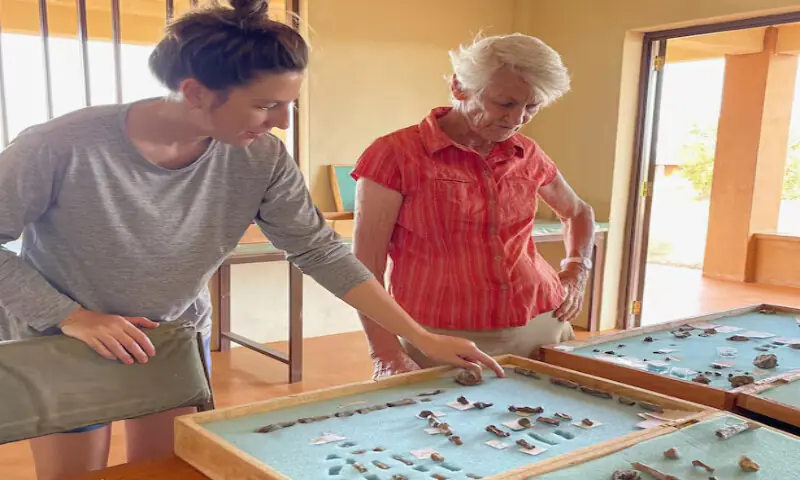 Researchers Carrie Mongle and Meave Leakey discuss Paranthropus boisei hand fossils at the Turkana Basin Institute research station in Ileret, Kenya. – Reuters