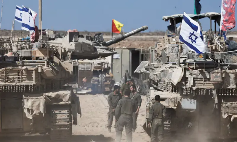 Israeli soldiers stand next to tanks near the Israel-Gaza border, in Israel, October 19, 2025. REUTERS Israeli soldiers stand next to tanks near the Israel-Gaza border, in Israel, October 19, 2025. REUTERS