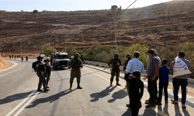 Members of the Israeli forces stand guard as they block the access of Palestinians and foreign activists to olive trees during the olive harvest, near Hebron, in the Israeli-occupied West Bank, on October 23, 2025. Reuters Members of the Israeli forces stand guard as they block the access of Palestinians and foreign activists to olive trees during the olive harvest, near Hebron, in the Israeli-occupied West Bank, on October 23, 2025. Reuters