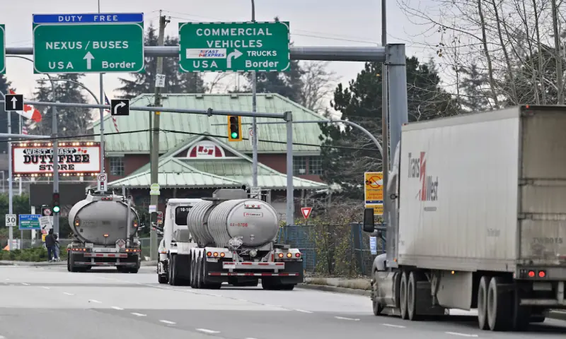 [1/2] Commercial trucks head towards the U.S. Customs and Border Protection (CBP) Pacific Highway Port of Entry from south Surrey, British Columbia, Canada, November 26, 2024//REUTERS