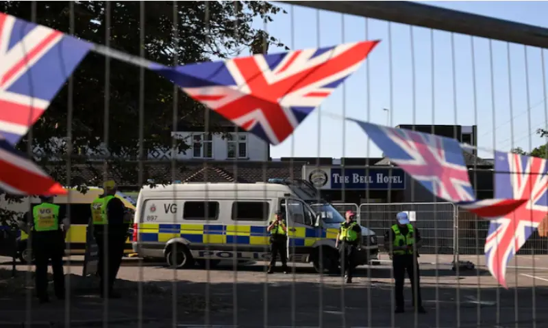 Police officers guard the entrance of the Bell Hotel, as demonstrators attend an anti-immigration protest, in Epping, Britain, August 8, 2025. Reuters file Police officers guard the entrance of the Bell Hotel, as demonstrators attend an anti-immigration protest, in Epping, Britain, August 8, 2025. Reuters file