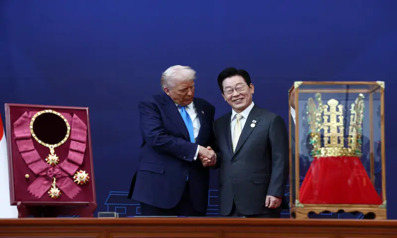 US President Donald Trump is presented with the “Grand Order of Mugunghwa” and a replica gold crown during a meeting with South Korean President Lee Jae Myung in Gyeongju, South Korea.– Reuters US President Donald Trump is presented with the “Grand Order of Mugunghwa” and a replica gold crown during a meeting with South Korean President Lee Jae Myung in Gyeongju, South Korea.– Reuters