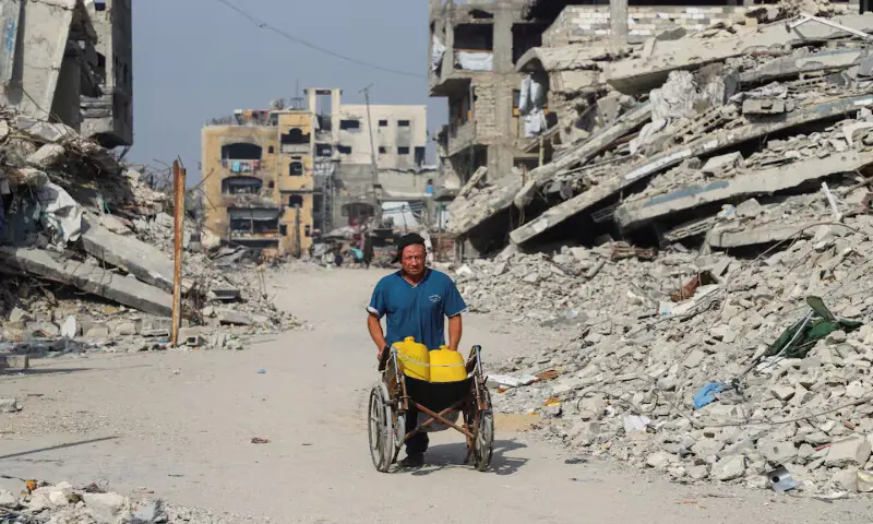 A Palestinian man walks near the so-called ‘yellow line’, in Gaza City on Sunday. – Reuters