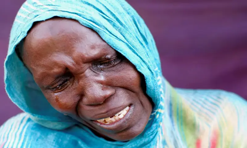 A woman from El Fasher cries after learning about the killing of her son and brother, in a camp in Al-Dabbah, Sudan, November 3, 2025//REUTERS